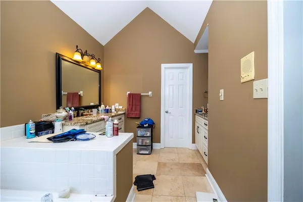 a living room with furniture and a mirror