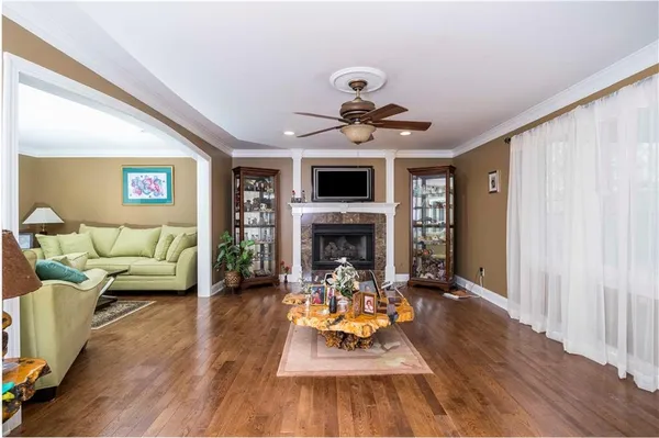 a living room with furniture and a fireplace
