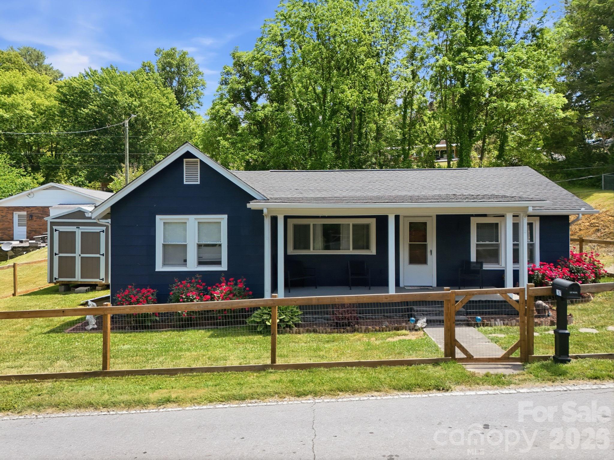 197 Mulberry Street Clyde, NC 28721 - Photo 1 of 31 a front view of house with yard outdoor seating and yard in back