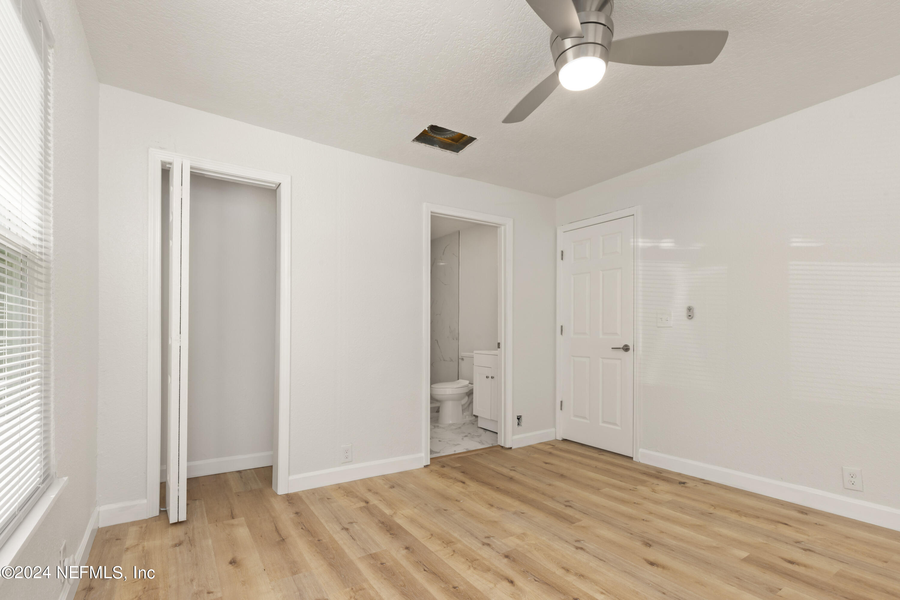 2448 Parental Home Road Jacksonville, FL 32216 - Photo 11 of 21 a view of empty room with wooden floor