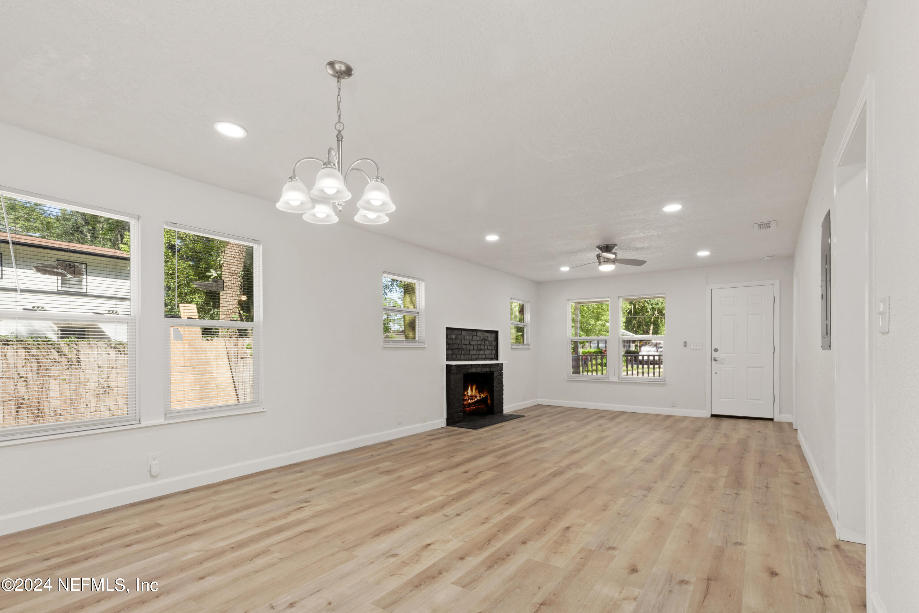 2448 Parental Home Road Jacksonville, FL 32216 - Photo 5 of 21 a view of a livingroom with a furniture window and wooden floor