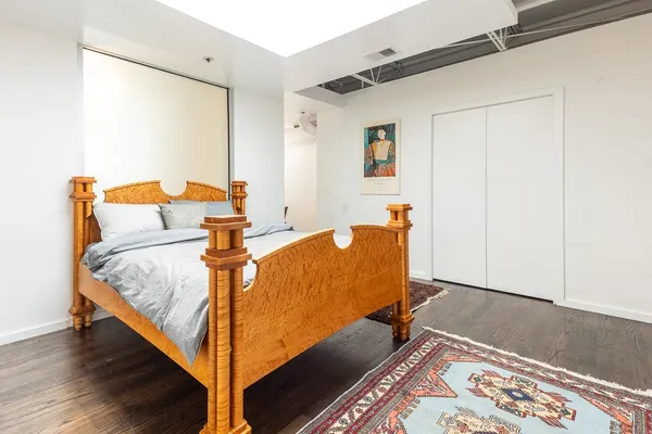 a bed room with a bed and a window