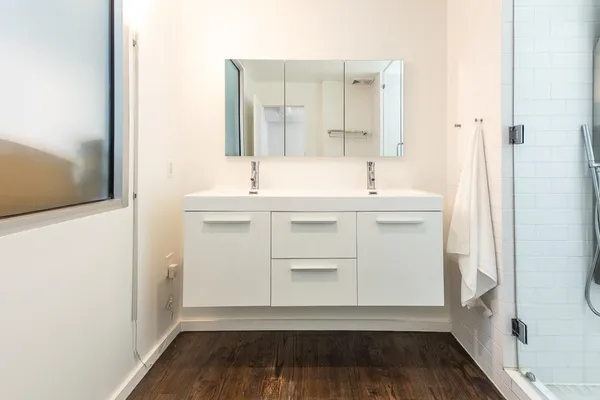 a bathroom with a glass shower door