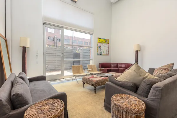 a living room with furniture and a table