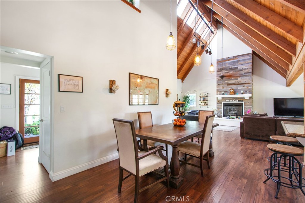 7241 Old Temescal Road Corona, CA 92881 - Photo 25 of 47 a view of a dining room with furniture window and wooden floor