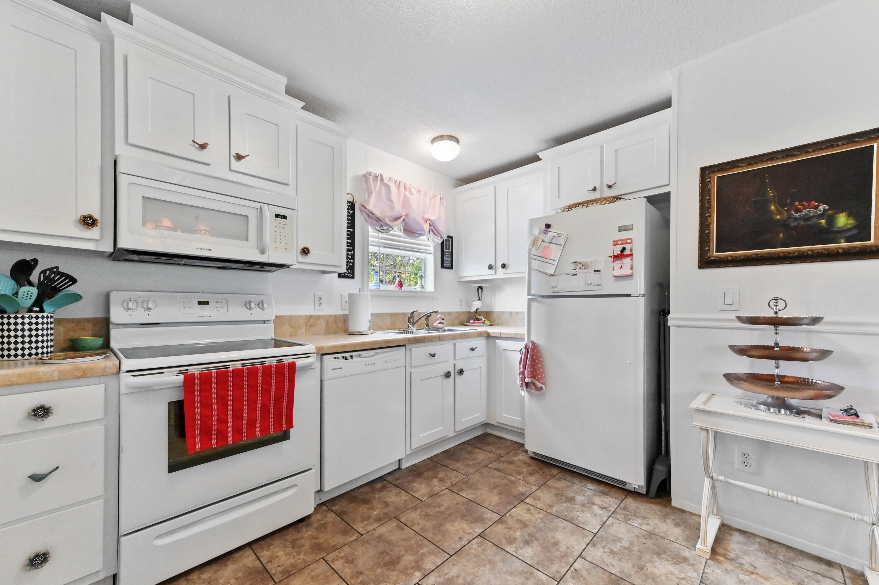 2 East View Street Lantana, FL 33462 - Photo 12 of 28 a kitchen with cabinets appliances and a counter top space
