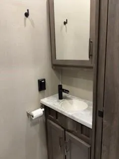 a bathroom with a sink and a mirror