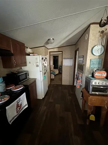 a kitchen with refrigerator and washer