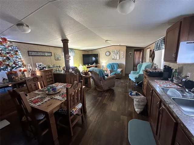 a living room with lots of furniture and a table