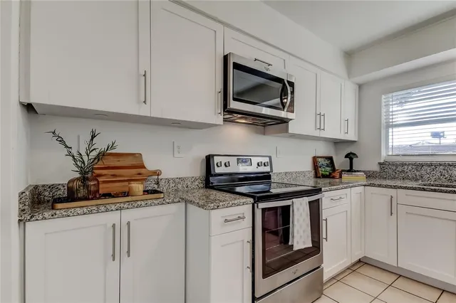 a view of a dining room with furniture wooden floor and chandelier