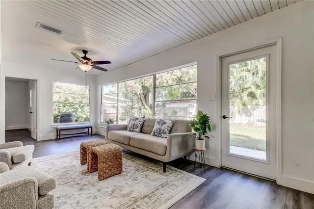 a front view of house with yard and trees