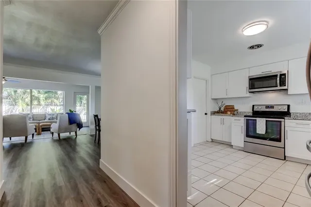a kitchen with granite countertop stainless steel appliances and sink