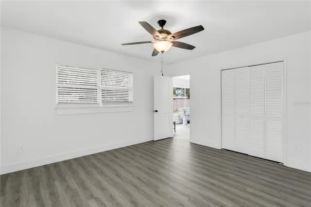 a bathroom with a sink toilet and a mirror