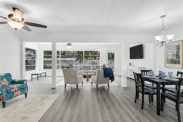 a kitchen with white cabinets appliances and a counter space