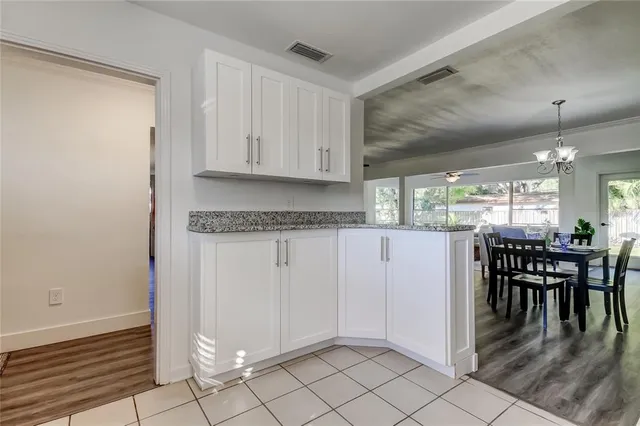 a front view of house with a garden and patio