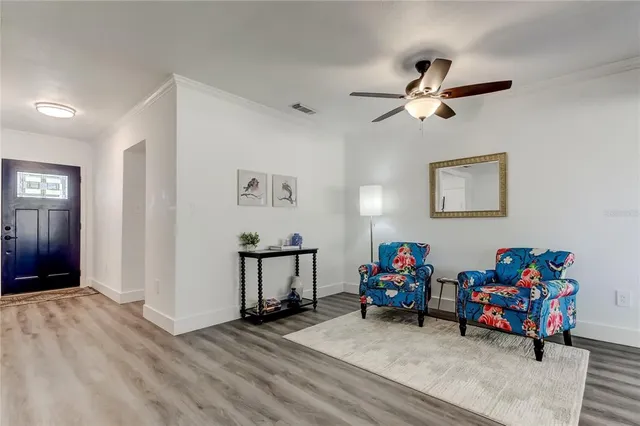 a bathroom with a toilet a sink a mirror and shower