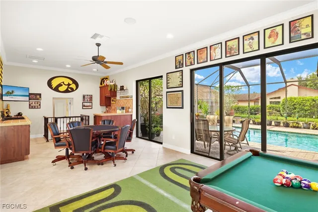 a view of a dining room with furniture a rug and wooden floor