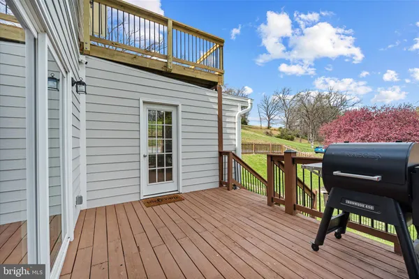 a view of a deck with wooden floor and seating space