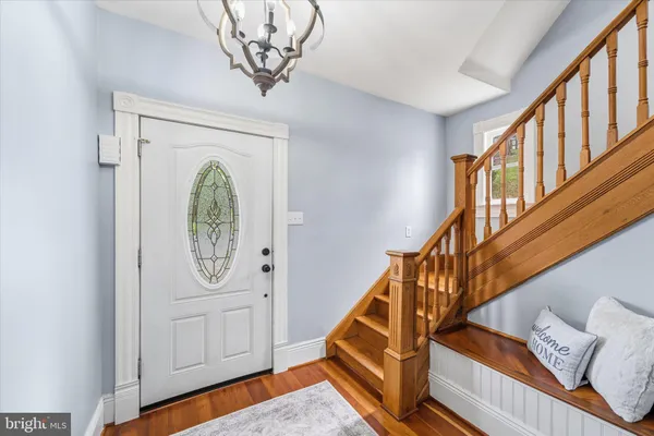 a view of an entryway with wooden floor