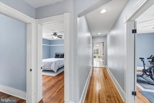 a view of bedroom with wooden floor