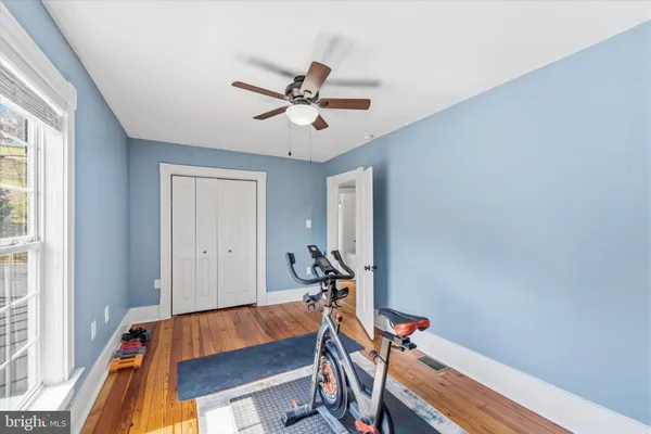 a room with a bed and a window