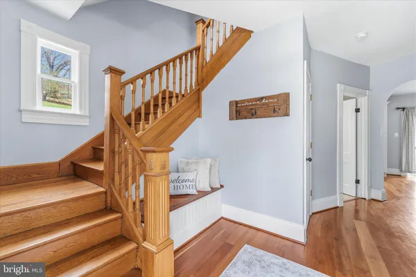 a view of an entryway with wooden floor