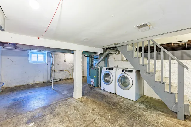a view of a storage & utility room with washer and dryer