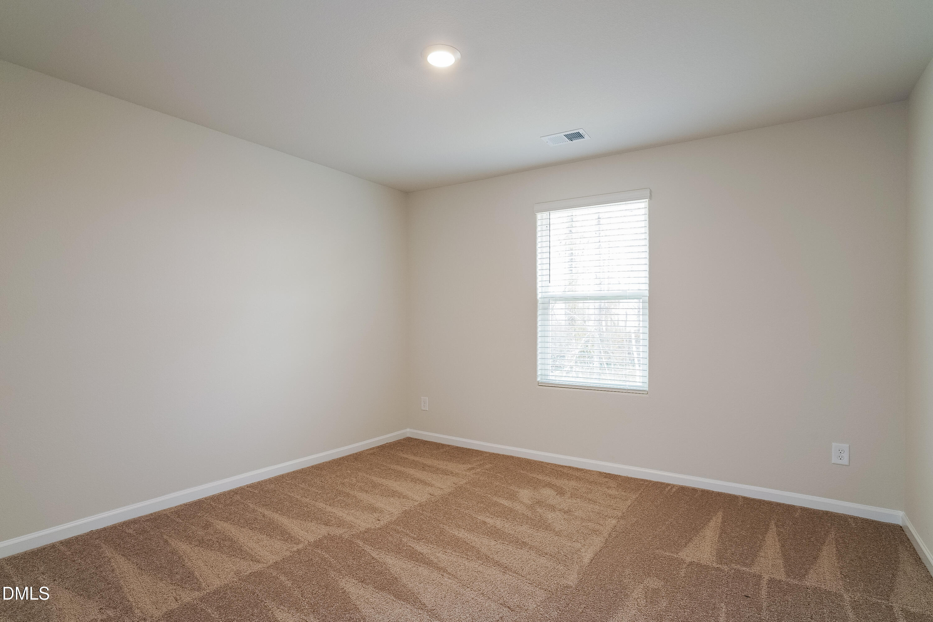 541 Gusty Lane Zebulon, NC 27597 - Photo 12 of 17 an empty room with a window