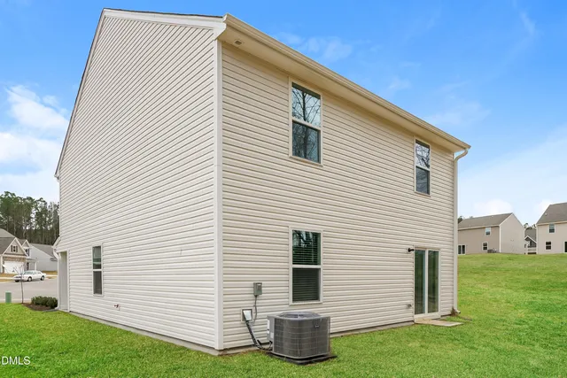a view of backyard with barbeque grill and a backyard