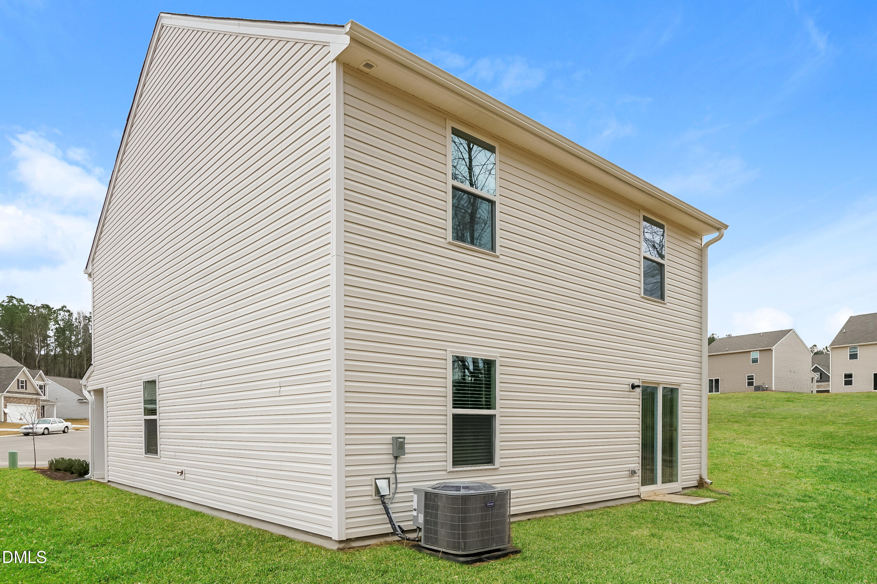 541 Gusty Lane Zebulon, NC 27597 - Photo 14 of 17 a view of backyard with barbeque grill and a backyard