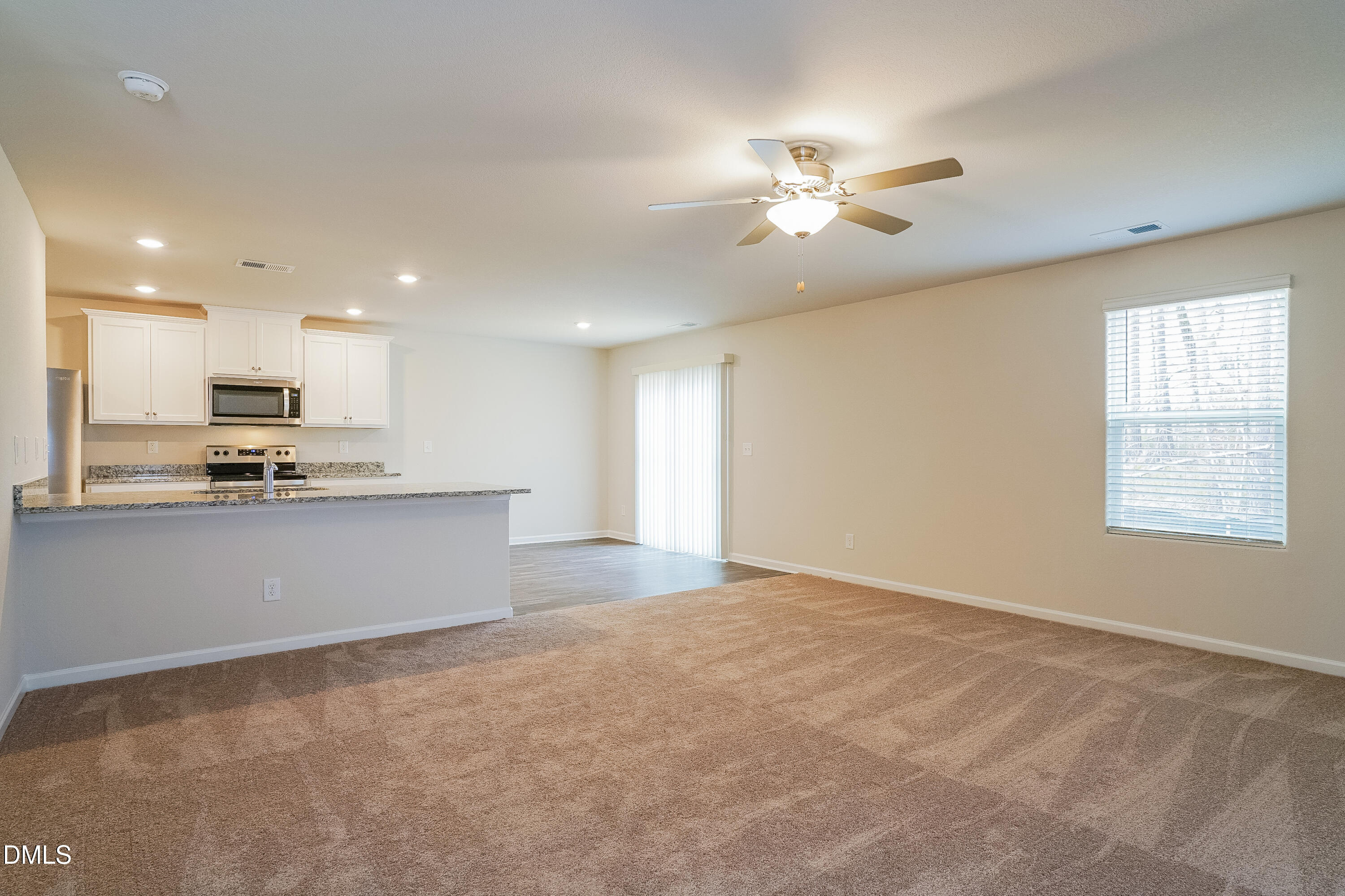 541 Gusty Lane Zebulon, NC 27597 - Photo 2 of 17 a view of kitchen with refrigerator and window