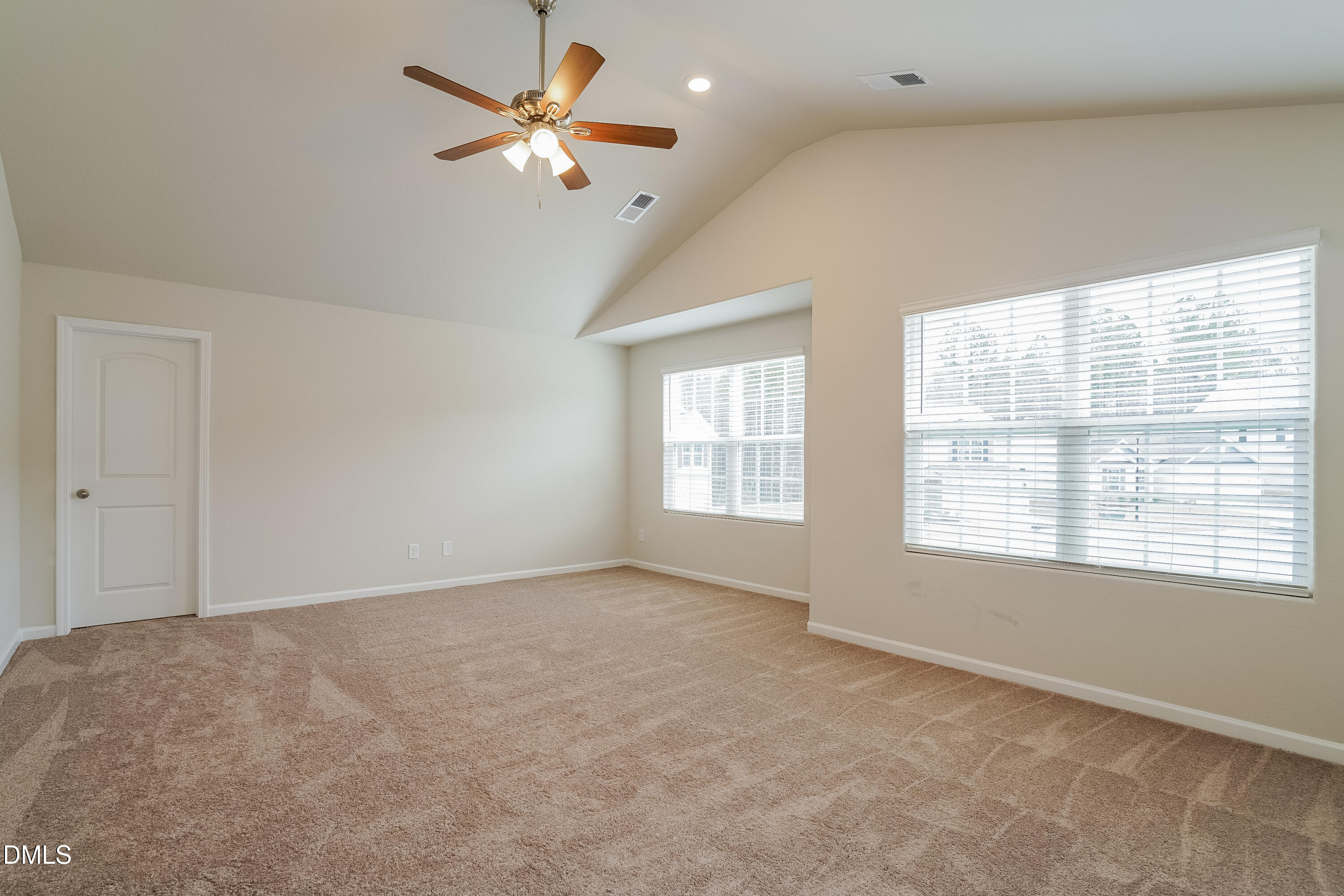 541 Gusty Lane Zebulon, NC 27597 - Photo 7 of 17 a view of an empty room with a window