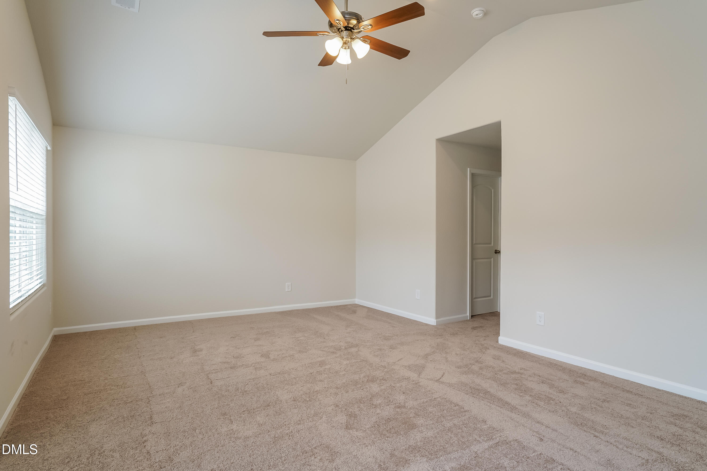 541 Gusty Lane Zebulon, NC 27597 - Photo 8 of 17 an empty room with window and ceiling fan