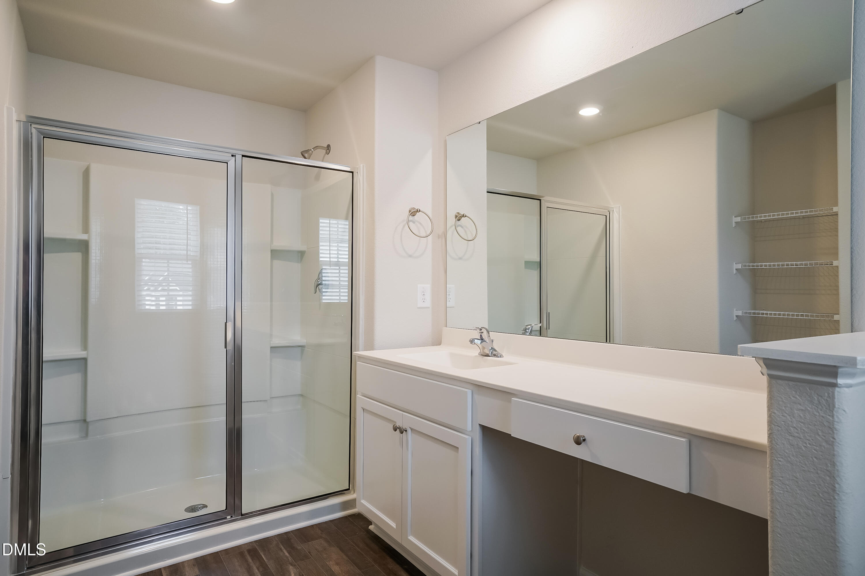 541 Gusty Lane Zebulon, NC 27597 - Photo 9 of 17 a bathroom with a shower sink and mirror