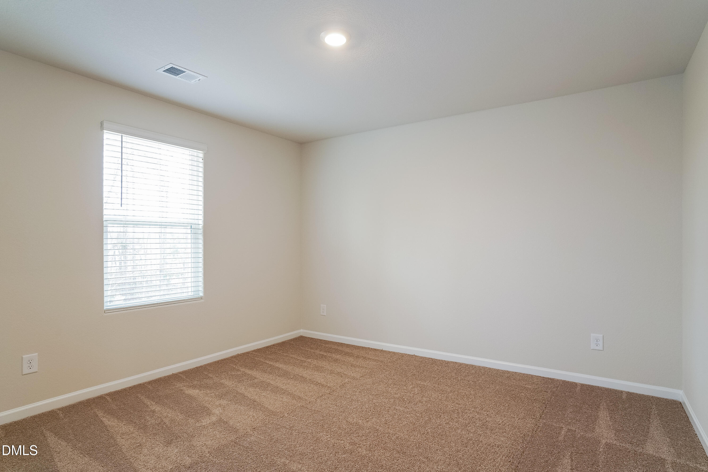 541 Gusty Lane Zebulon, NC 27597 - Photo 10 of 17 an empty room with a window