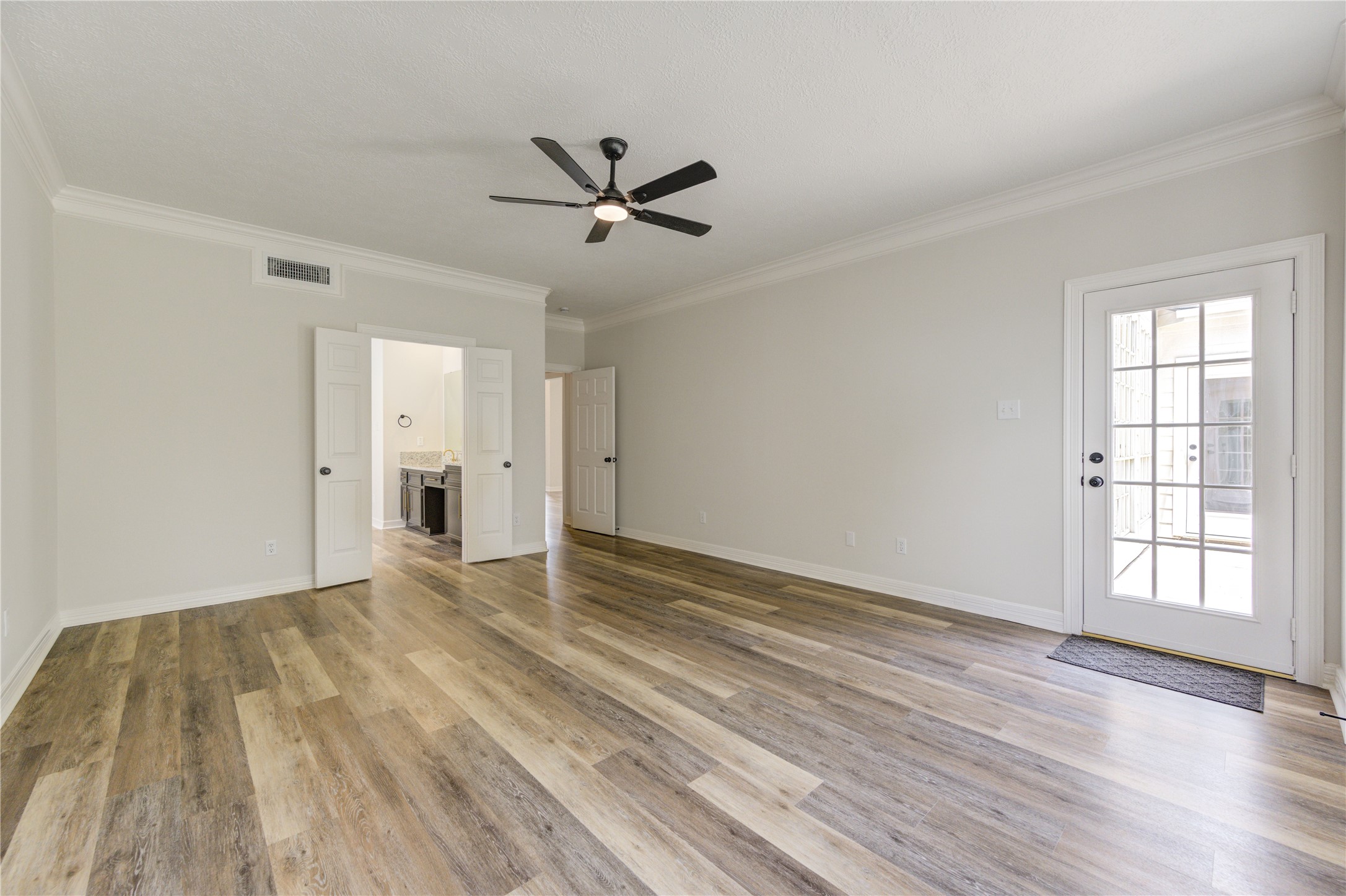 17318 Bonnard Circle Spring, TX 77379 - Photo 25 of 45 Another view of the primary suite showing the exterior door to the backyard. This door would be super convenient if ever a pool was added.