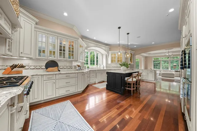 a view of living room with furniture and a fireplace