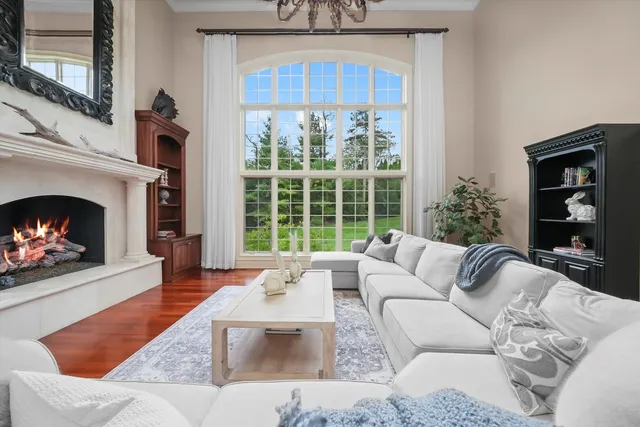 a very nice looking room with a large window and chandelier