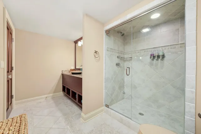 a living room with lots of furniture and a large window