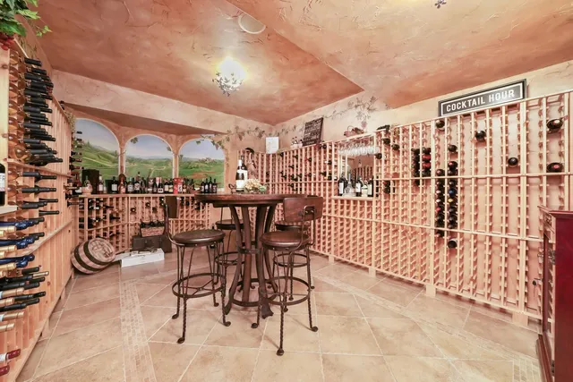 a large bedroom with a bed and a dresser