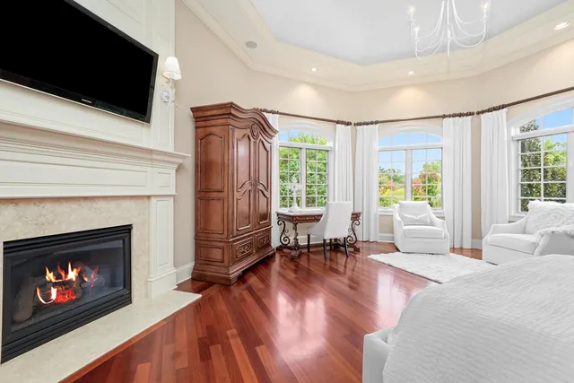 a bed room with furniture and a chandelier