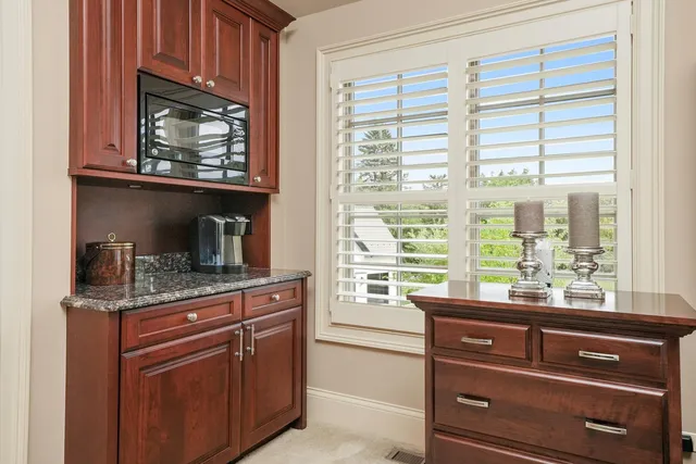 a view of a fire pit in a backyard