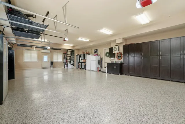 an aerial view of a house with a yard and garden