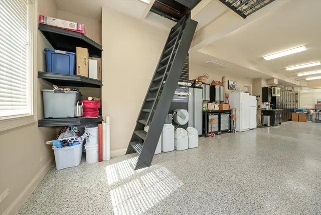 an aerial view of a house with a swimming pool
