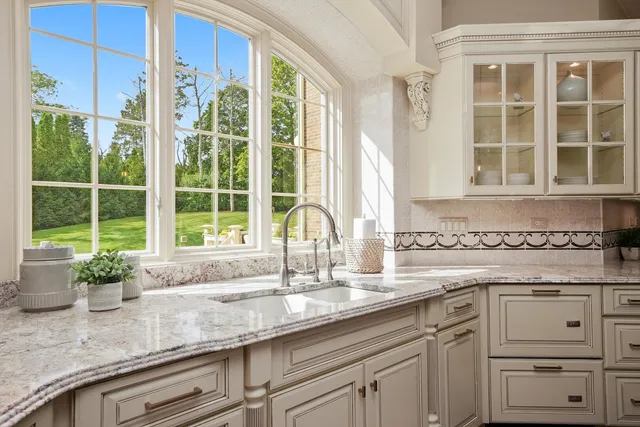 a kitchen with stainless steel appliances a refrigerator and cabinets