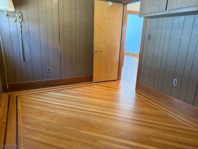 72 Baldwin Place, Unit 2 Bloomfield, NJ 07003 - Photo 17 of 24 a view of an empty room with wooden floor