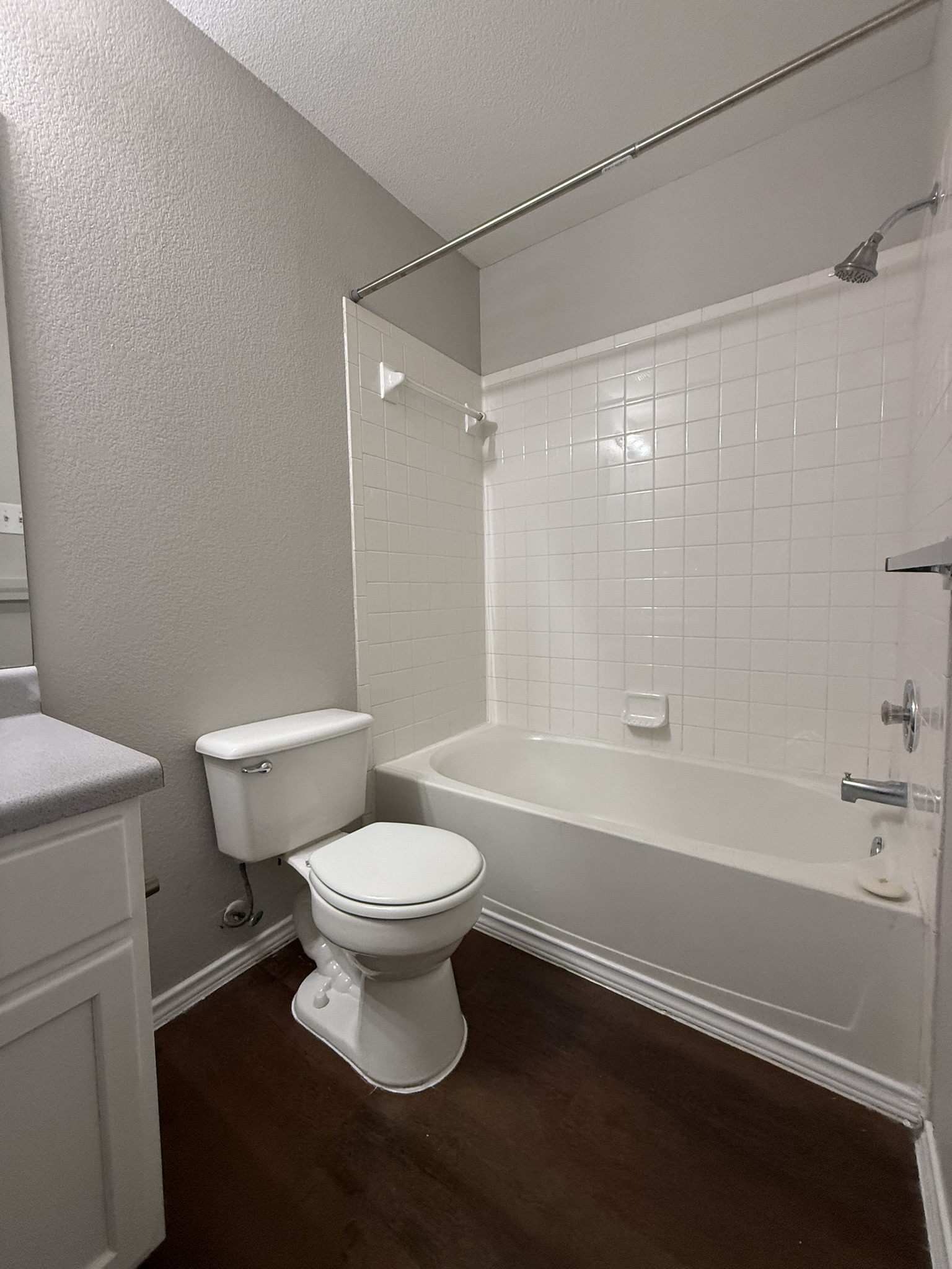 6726 Windrift Way, Unit A Austin, TX 78745 - Photo 12 of 29 a white toilet sitting next to a bath tub