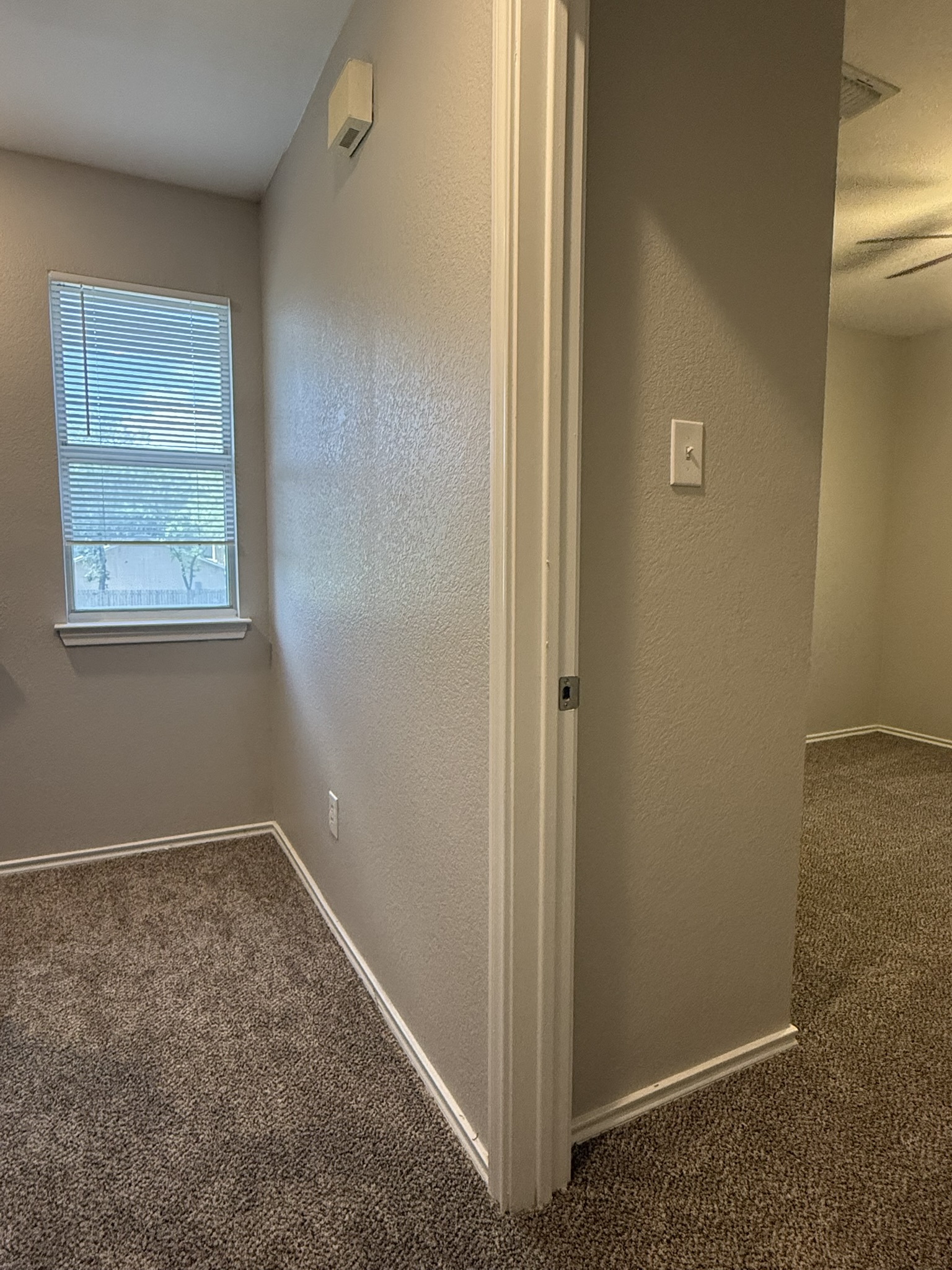 6726 Windrift Way, Unit A Austin, TX 78745 - Photo 14 of 29 an empty room with windows