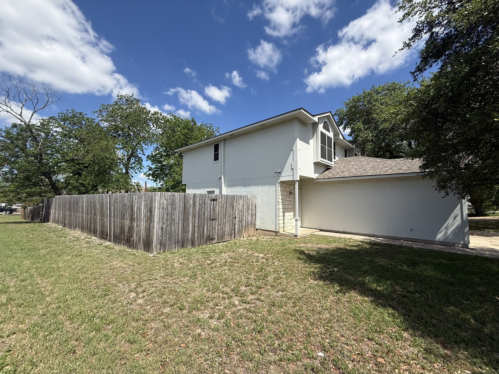 6726 Windrift Way, Unit A Austin, TX 78745 - Photo 2 of 29 a view of backyard of house with green space