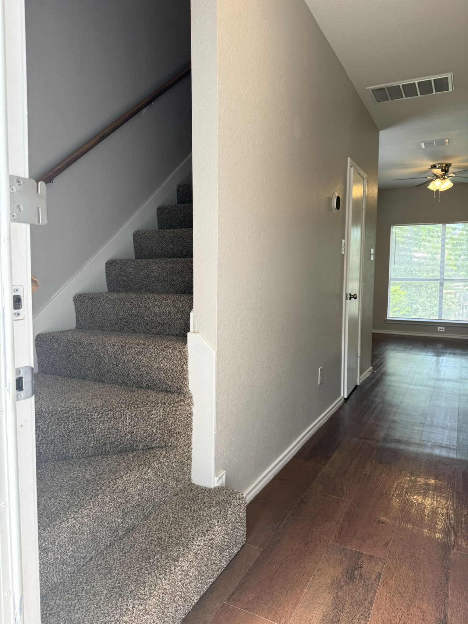 6726 Windrift Way, Unit A Austin, TX 78745 - Photo 24 of 29 a view of staircase with white walls and windows
